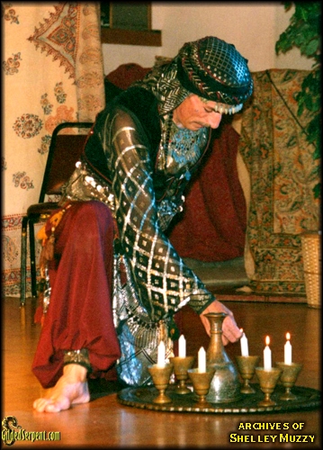 John lighting his tray candles
